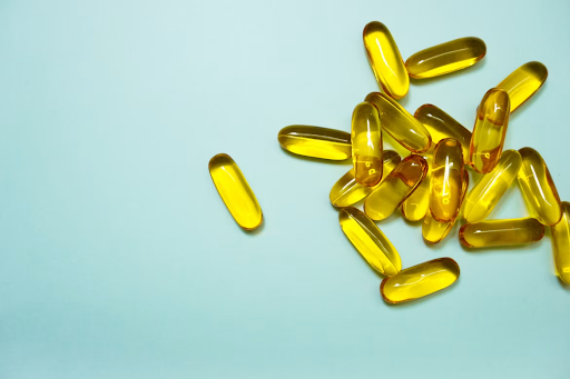 Yellow capsules arranged on a blue background